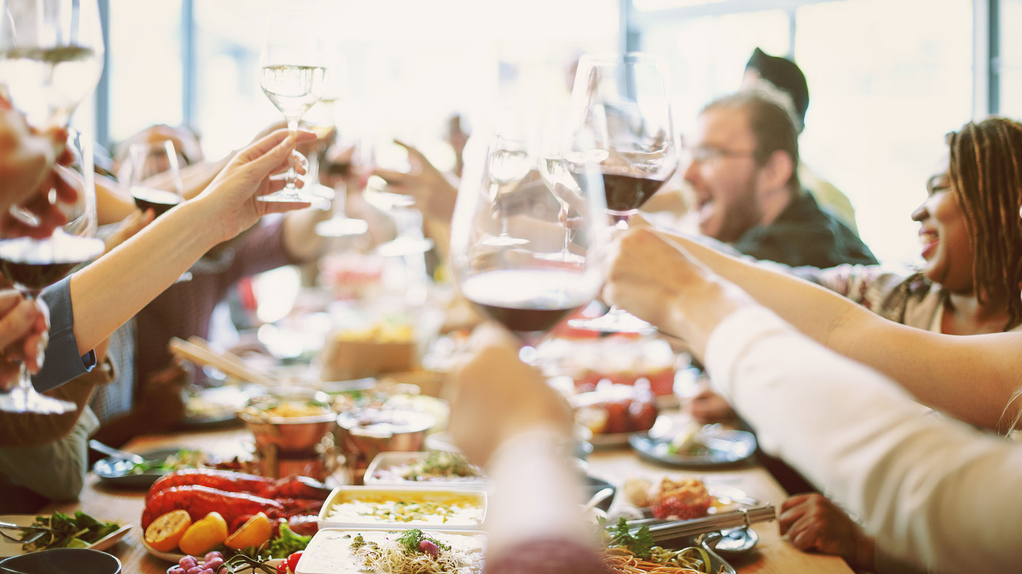 group sharing lunch and wine